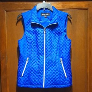 Black rivet blue vest.